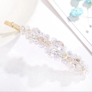 Elegant gold metal hair clip with hand-woven faceted clear crystals and minimalist beads