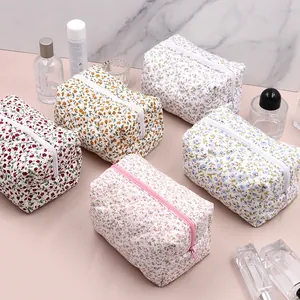 5-piece set of floral quilted cotton makeup bags with top zipper closure in multiple colors