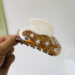 Elegant swan-shaped star patterned marble hair claw clip for a vintage styling look