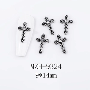 Macro detail of gothic retro cross nail charms with clear rhinestone in 9x14mm size