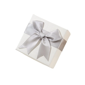 Elegant white jewelry gift box with silver satin ribbon bow for rings and necklaces