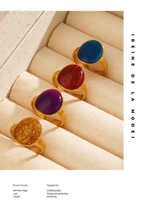 Set of four French vintage adjustable gold rings with oval colored enamel and gemstones