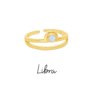 Close-up of golden adjustable Libra ring with zircon stone and 925 silver stamp