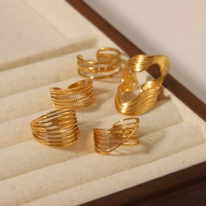 Set of five 18K gold plated minimalist vintage rings and earrings on velvet display