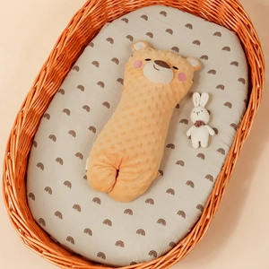 Close-up of yellow minky fabric baby long soothing pillow with cute bear shape