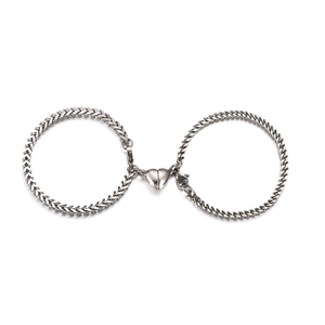 Magnetic heart couples bracelets in stainless steel wheat chain style on white background