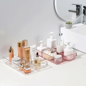 Transparent and light pink drawer organizers set for bathroom vanity and desk storage