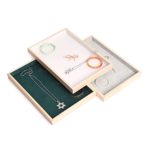 Three-piece stackable solid wood jewelry display trays with velvet lining in neutral tones