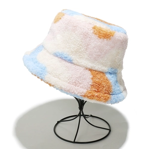 Detail of colorful faux shearling bucket hat featuring soft macaron tie-dye plush texture
