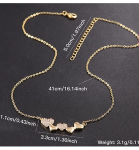 Detail showing gold heart necklace dimensions with zircon inlay and polished finish