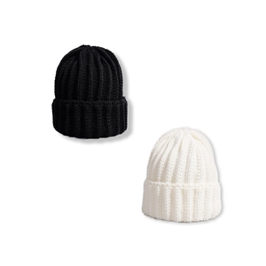Classic black and white knit beanies with thick vertical ribbed texture and wide cuffs