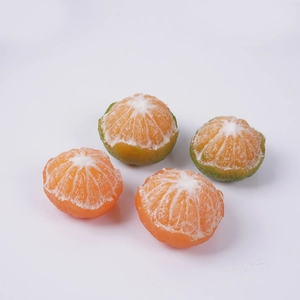 Realistic peeled frozen orange and green mandarin prop with detailed white ice crystals