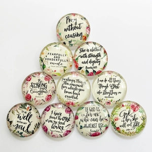 Detailed view of mixed glowing glass cabochons with inspirational floral patterns
