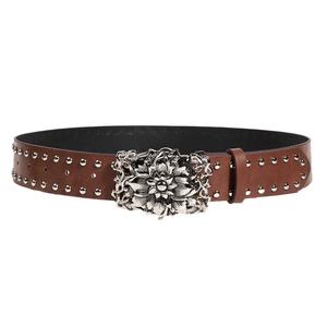 Brown leather punk belt with silver studs and an intricate floral metal buckle