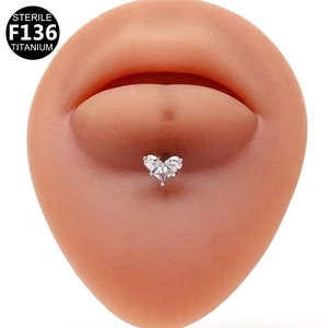 Sterile F136 titanium heart labret stud shown on model for professional piercing