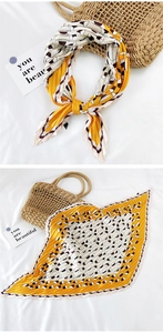 Macro detail of pleated square scarf with ginger and cream geometric striped prints