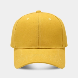 Detail of high-quality yellow cotton baseball cap with structured panels and reinforced stitching