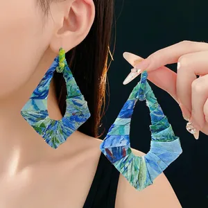 Irregular fabric drop earrings featuring Van Gogh style oil painting textures on black background