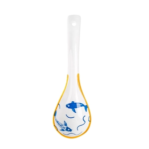 Japanese style white ceramic soup spoon with blue koi fish pattern and curved handle