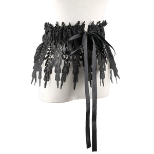 Close-up of black lace waist cincher featuring intricate patterns and satin ribbon bow