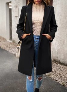 Classic black wool coat for women in an elegant outdoor street style setting