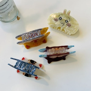 Set of four cute animal and textured acetate hair claws including a yellow bunny design