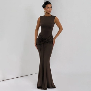 Detailed view of the elegant knot design and ruching on the waist of a slim long dress