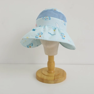 Detail of light blue sun hat for kids featuring elephant prints and breathable mesh top