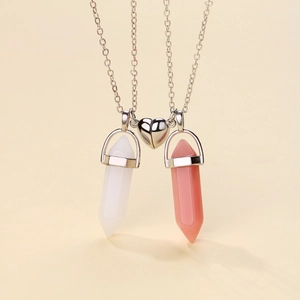 Detail showing hexagonal natural stone pendants with heart magnet link on beige background