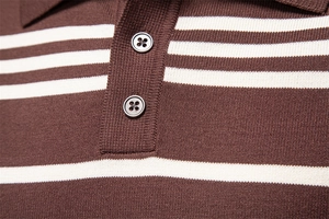 Close-up of the double-button placket and collar texture on a brown striped polo sweater