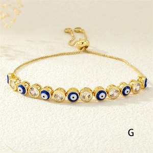 Detail of adjustable evil eye bracelet with blue enamel beads and cubic zirconia stones