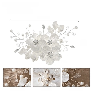 Detail view of handmade bridal floral hair clip with size dimensions and pearl textures