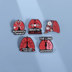 Five-piece set of red medical lung enamel pins featuring stethoscope and floral patterns