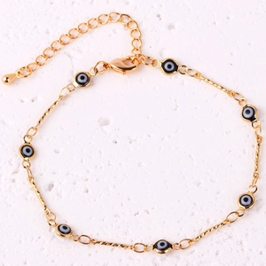 Detail of gold-plated evil eye bracelet with lobster clasp and adjustable extension chain
