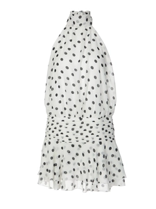 Polka dot halter neck sleeveless mini dress in white with black dots and ruffled hemline