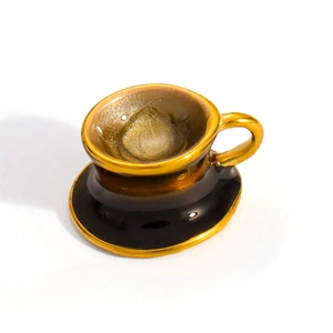 Macro view of a 18k gold plated cup pendant with black base and sparkling interior finish