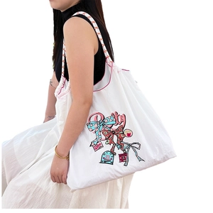 White embroidered ball chain canvas shopping bag with colorful pretty bow print