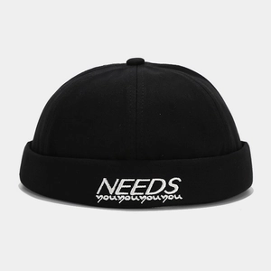 Unisex black miki hat with white NEEDS embroidery for trendy streetwear look