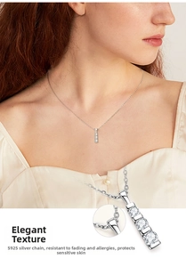 Detailed view of S925 sterling silver necklace with three vertical stones on a model