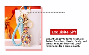 Detail of crystal turtle keychain with blue braided strap and gold lucky coin charm