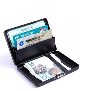 Internal view of black aluminum card case showing slots for cards, IDs and bill compartment