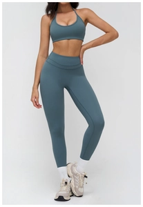 Detailed full-body view of grey-blue yoga set with halter bra and high-waist leggings