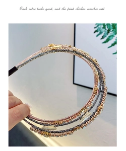 Close-up of triple-layered headband featuring sparkling rhinestones and woven wire finish