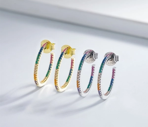 Detail shot of 925 sterling silver stamp on rainbow zircon gold-plated earrings