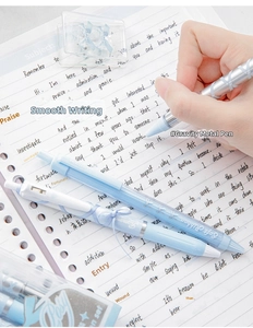 Detailed shot of soft ribbon gel pen writing on notebook with elegant bow textures