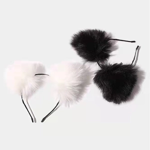 Detailed close-up of plush cat ear headbands in black and white soft faux fur