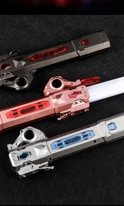 Detailed close-up of sci-fi toy sword handles in silver, rose gold, and deep gray finishes