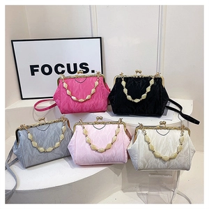 Collection of pleated shell bags with pearl beaded handles in five elegant colors