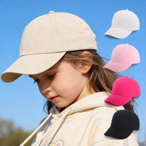 Kids cotton baseball cap in various colors featuring curved brim for sun protection