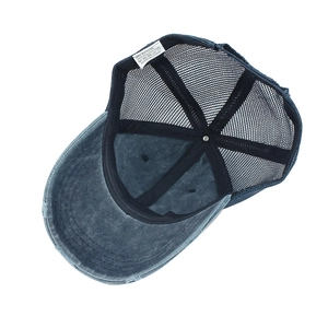 Detail view of cotton-polyester mesh baseball cap with interior labels and stitching